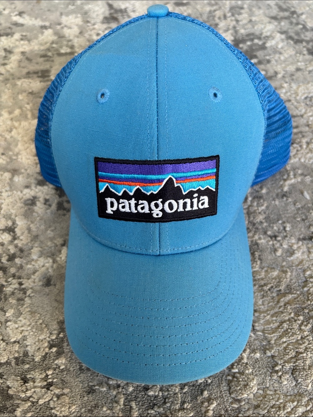 Patagonia Light Blue Trucker Hat with Multicolor Logo
